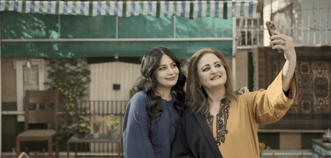 Two women taking a selfie together during a UNFPA program or event